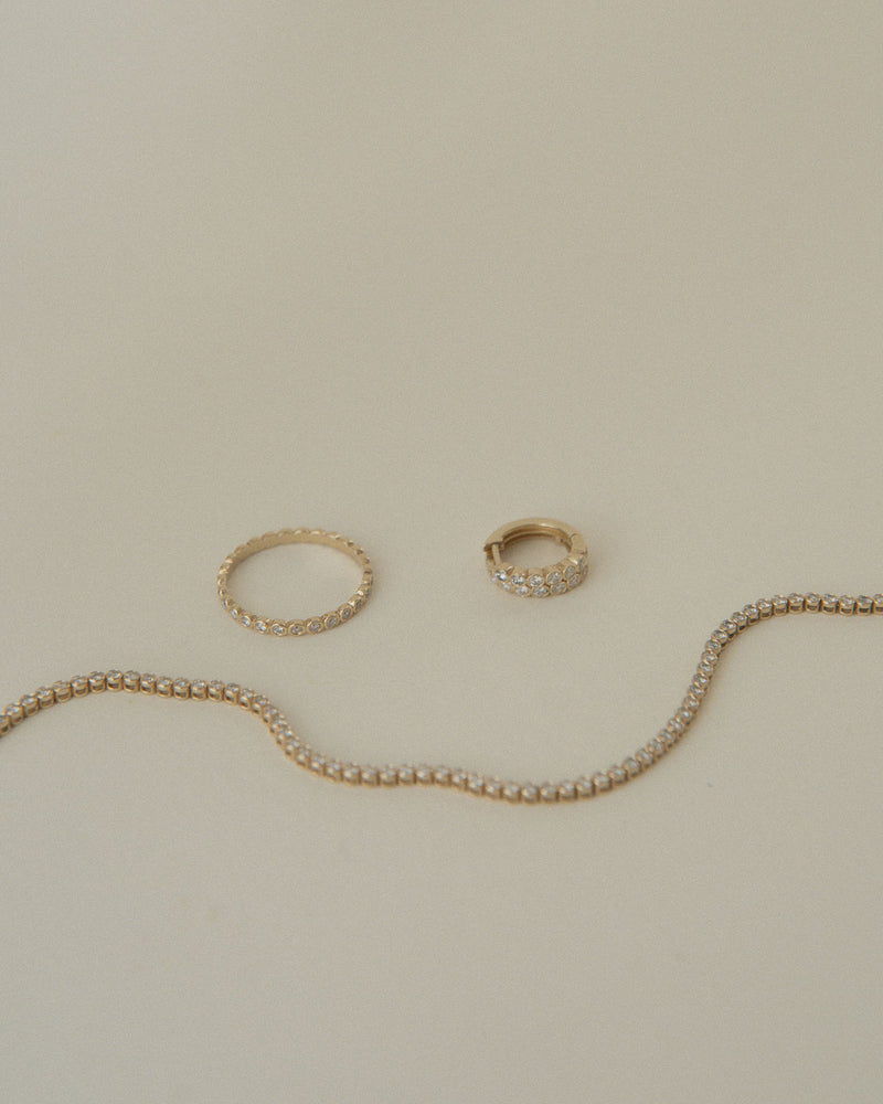 
                  
                    April-First-Berlin-Fine-Jewelry-14k-Gold-Diamond-Bezel-Ring-Bracelet-Huggies
                  
                