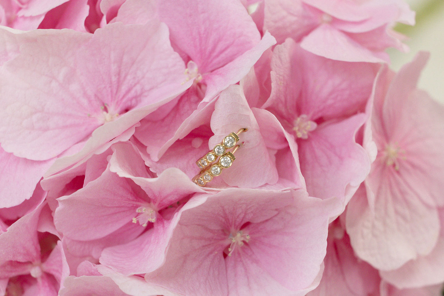 
                  
                    April First 14k Gold Bezel Ombré Huggies
                  
                